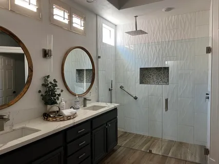 a bathroom with a double vanity sink and a mirror