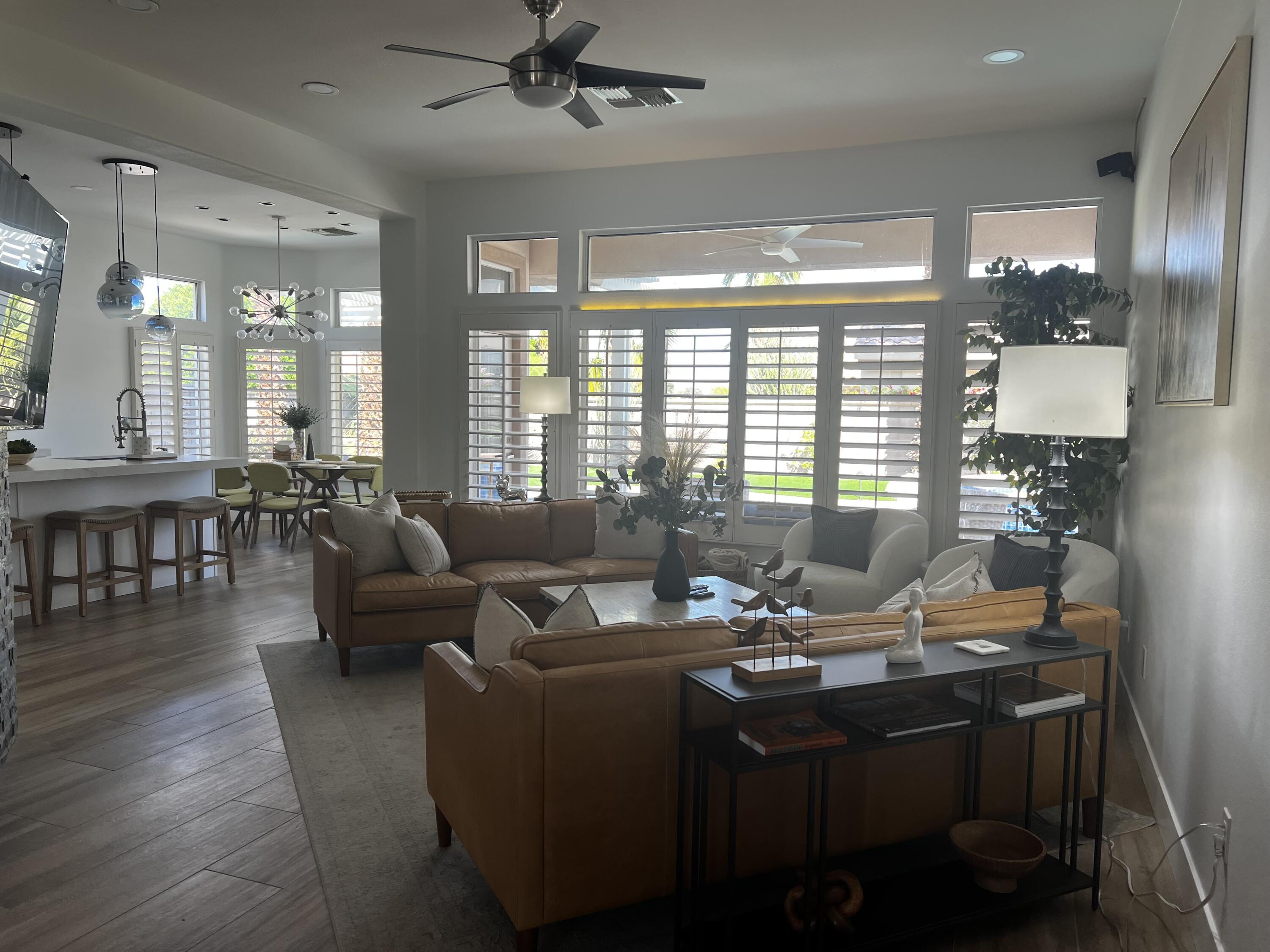 38286 Brandywine Avenue Palm Desert, CA 92211 - Photo 4 of 22 a living room with furniture and floor to ceiling windows