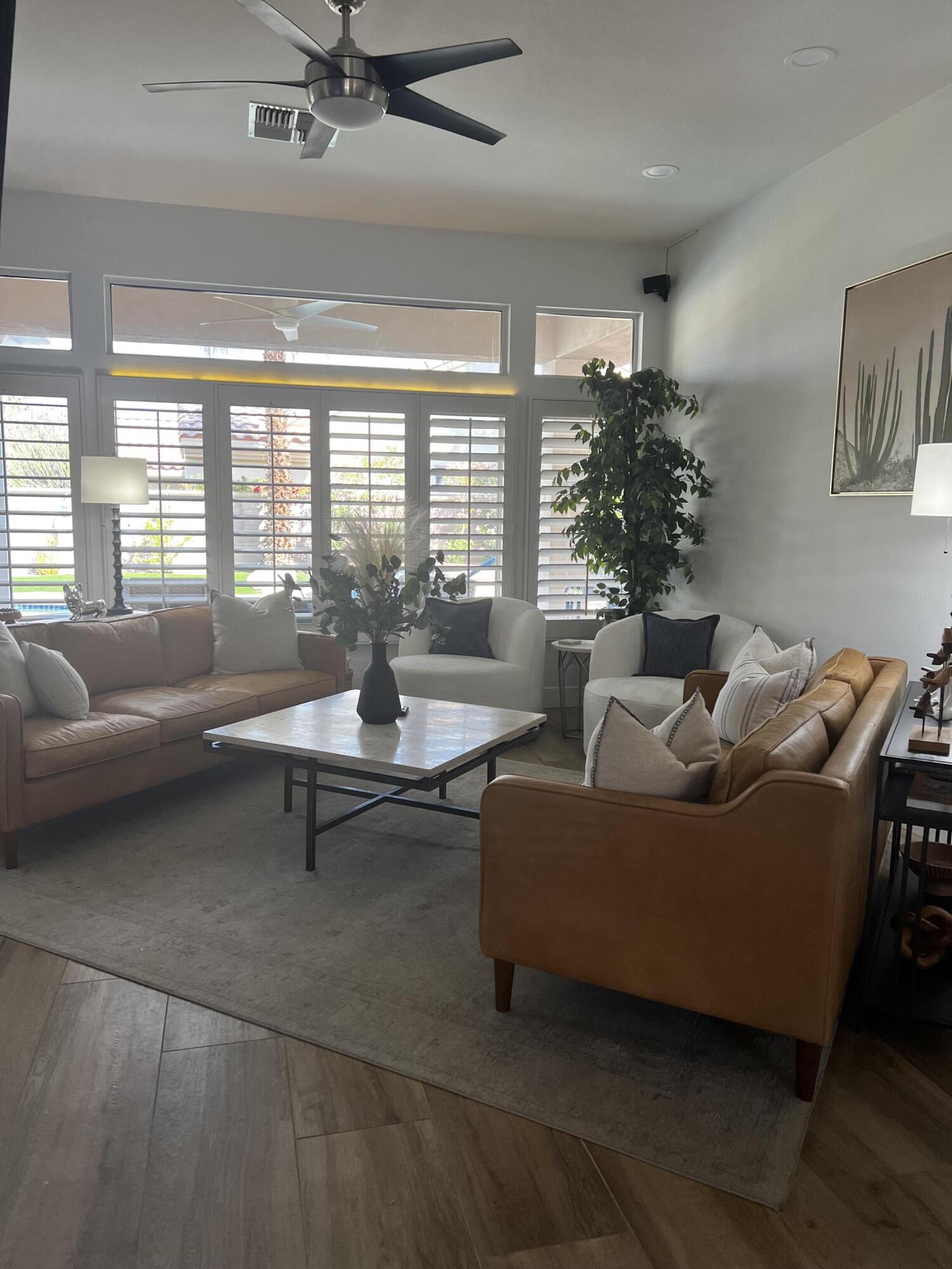 38286 Brandywine Avenue Palm Desert, CA 92211 - Photo 5 of 22 a living room with furniture and a large window