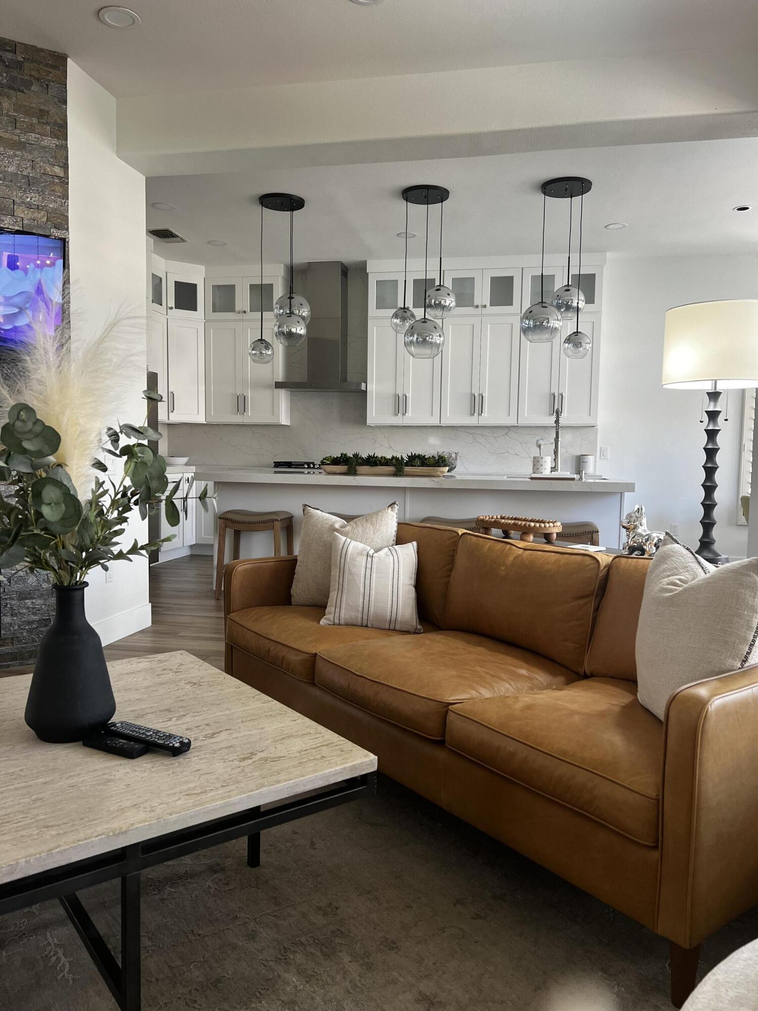 38286 Brandywine Avenue Palm Desert, CA 92211 - Photo 7 of 22 a living room with furniture kitchen view and a potted plant