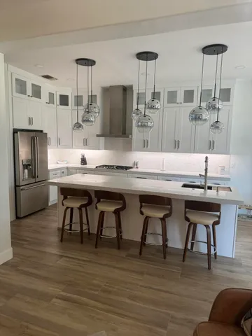 a kitchen with a table chairs and entryway