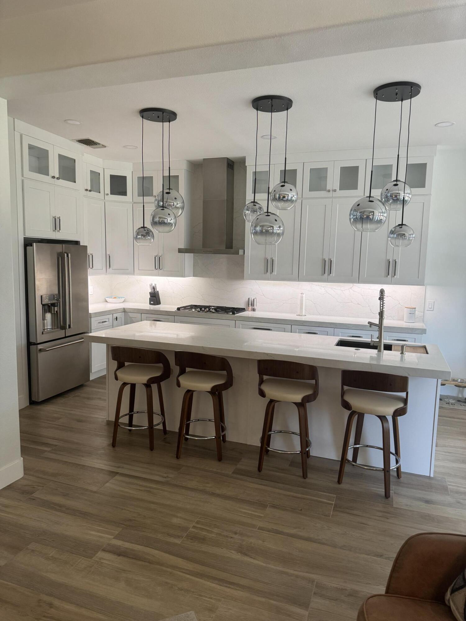 38286 Brandywine Avenue Palm Desert, CA 92211 - Photo 10 of 22 a kitchen with a table chairs and entryway