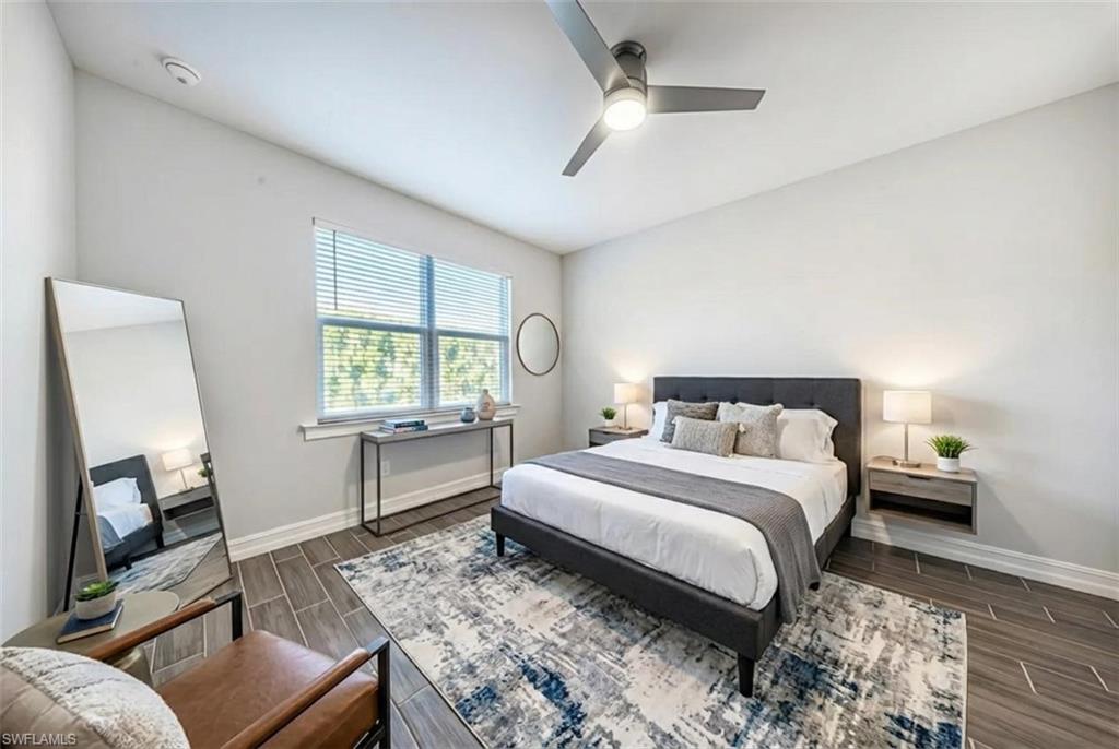 1059 Enbrook Loop Naples, FL 34114 - Photo 12 of 40 Bedroom with wood finish floors and a ceiling fan