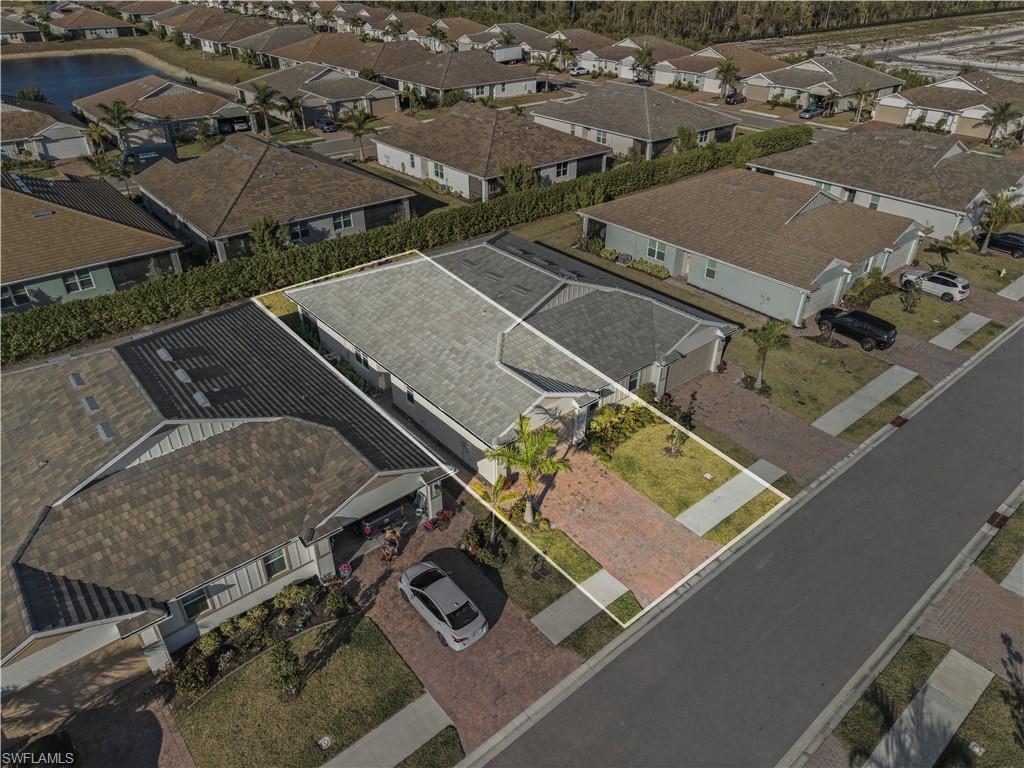 1059 Enbrook Loop Naples, FL 34114 - Photo 2 of 40 Aerial perspective of suburban area