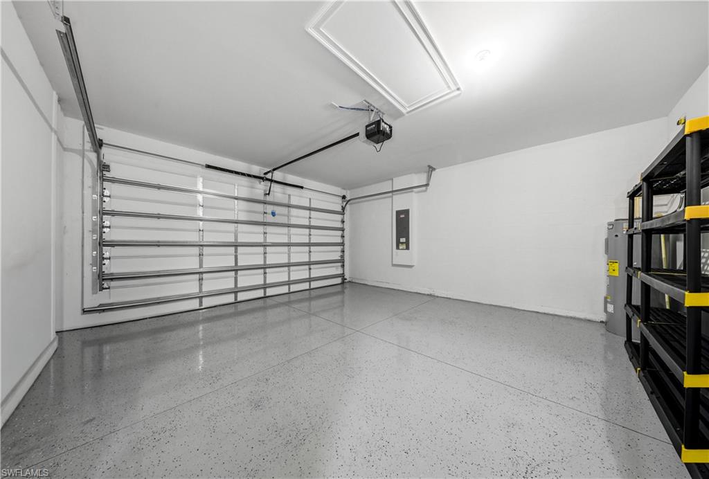 1059 Enbrook Loop Naples, FL 34114 - Photo 27 of 40 Garage featuring electric panel