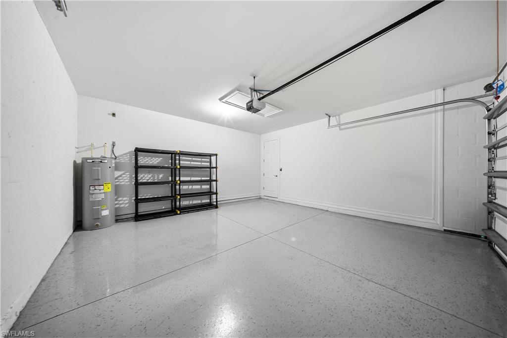 1059 Enbrook Loop Naples, FL 34114 - Photo 28 of 40 Garage featuring water heater