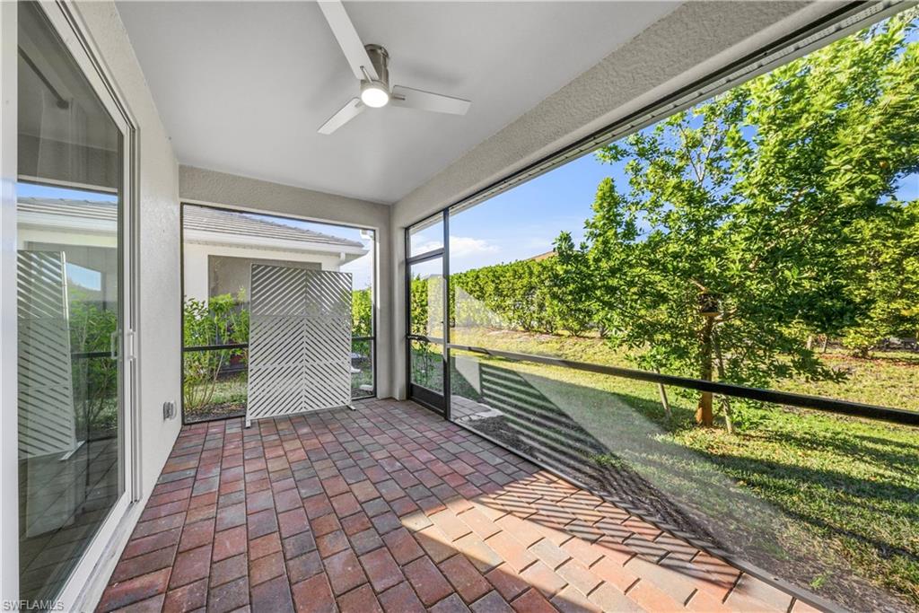 1059 Enbrook Loop Naples, FL 34114 - Photo 29 of 40 Unfurnished sunroom with ceiling fan