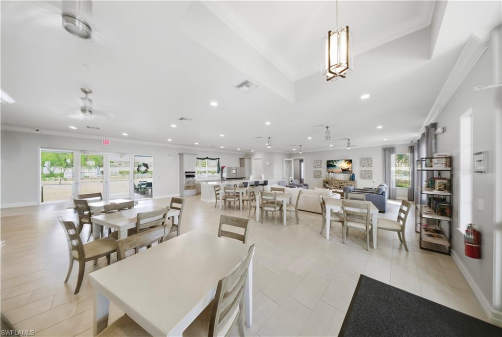 1059 Enbrook Loop Naples, FL 34114 - Photo 36 of 40 Dining area featuring ornamental molding, ceiling fan, recessed lighting, and light tile patterned floors