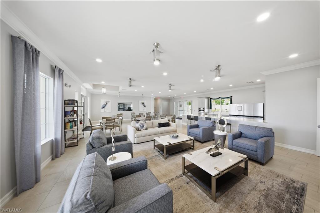 1059 Enbrook Loop Naples, FL 34114 - Photo 5 of 40 Living area featuring ornamental molding and recessed lighting
