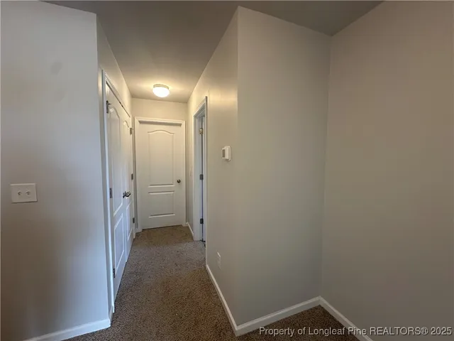 a view of hallway with a mirror