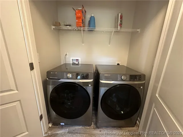 a utility room with dryer and washer