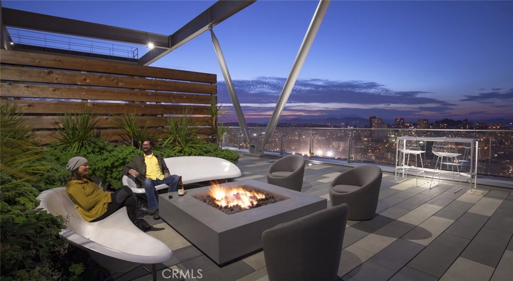 100 Van Ness Avenue, Unit 402 San Francisco, CA 94102 - Photo 14 of 75 a view of a chairs and table in the patio