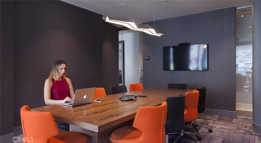 100 Van Ness Avenue, Unit 402 San Francisco, CA 94102 - Photo 21 of 75 a dining room with furniture and wooden floor