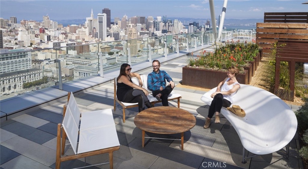 100 Van Ness Avenue, Unit 402 San Francisco, CA 94102 - Photo 24 of 75 a view of a balcony with table and chairs