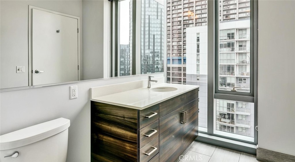 100 Van Ness Avenue, Unit 402 San Francisco, CA 94102 - Photo 7 of 75 a bathroom with a sink and a toilet