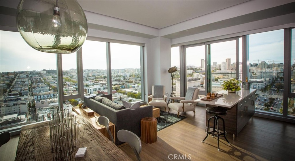 100 Van Ness Avenue, Unit 402 San Francisco, CA 94102 - Photo 9 of 75 a living room with furniture and a large window