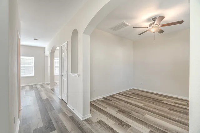a view of a livingroom with wooden floor and closet