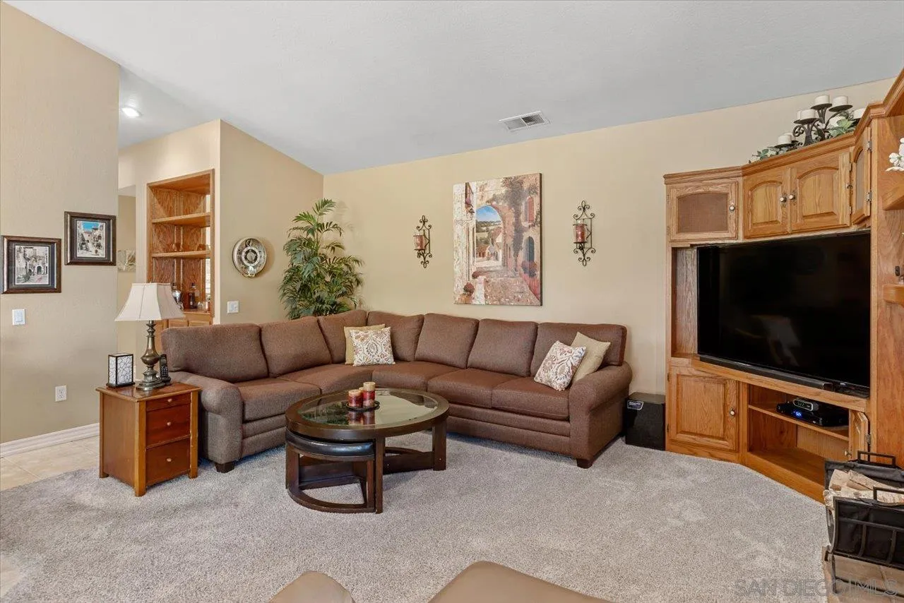 1787 Wolverine Way Vista, CA 92084 - Photo 15 of 35 a living room with furniture and a flat screen tv