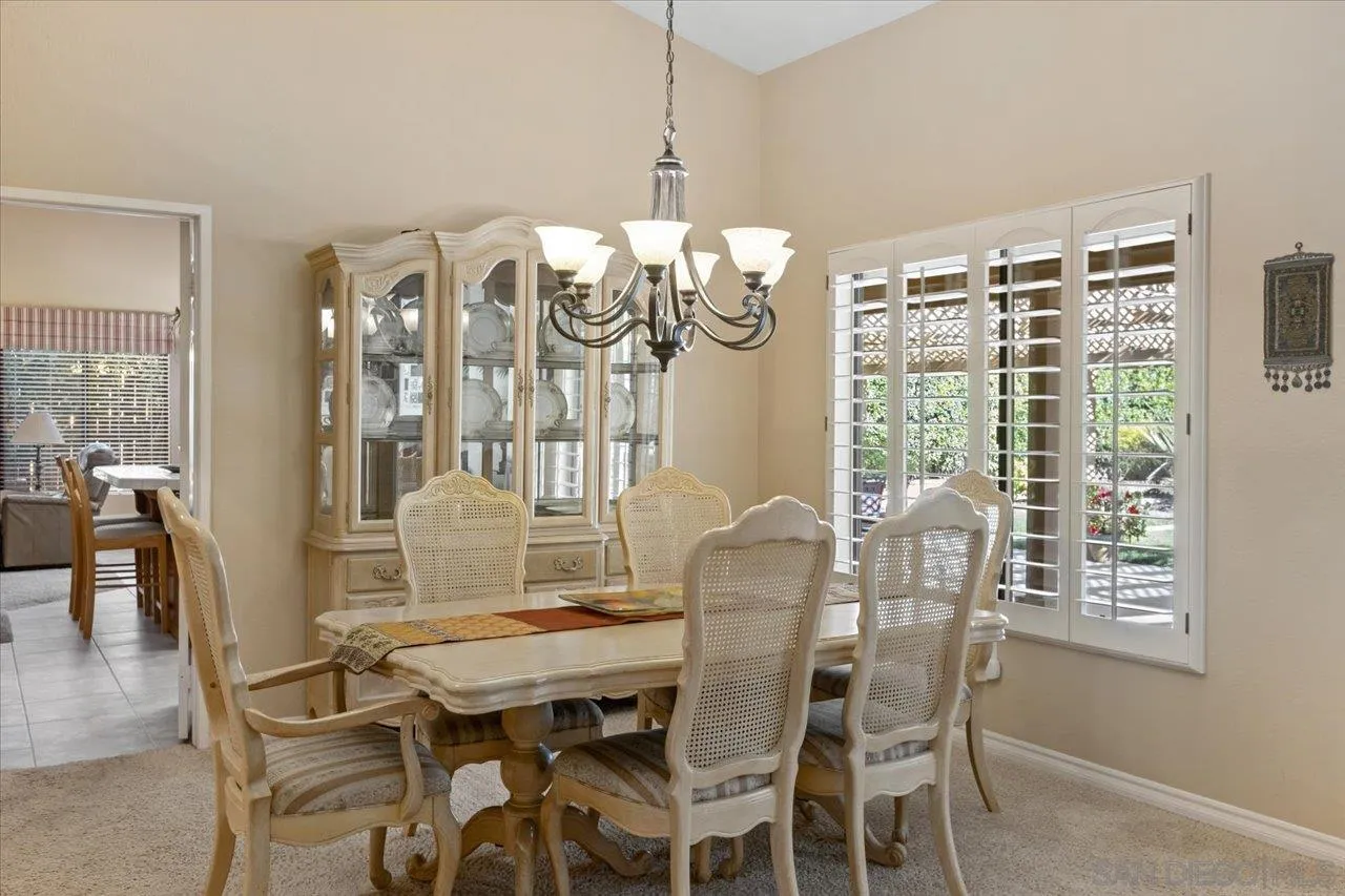 1787 Wolverine Way Vista, CA 92084 - Photo 16 of 35 a view of a dining room with furniture window and wooden floor