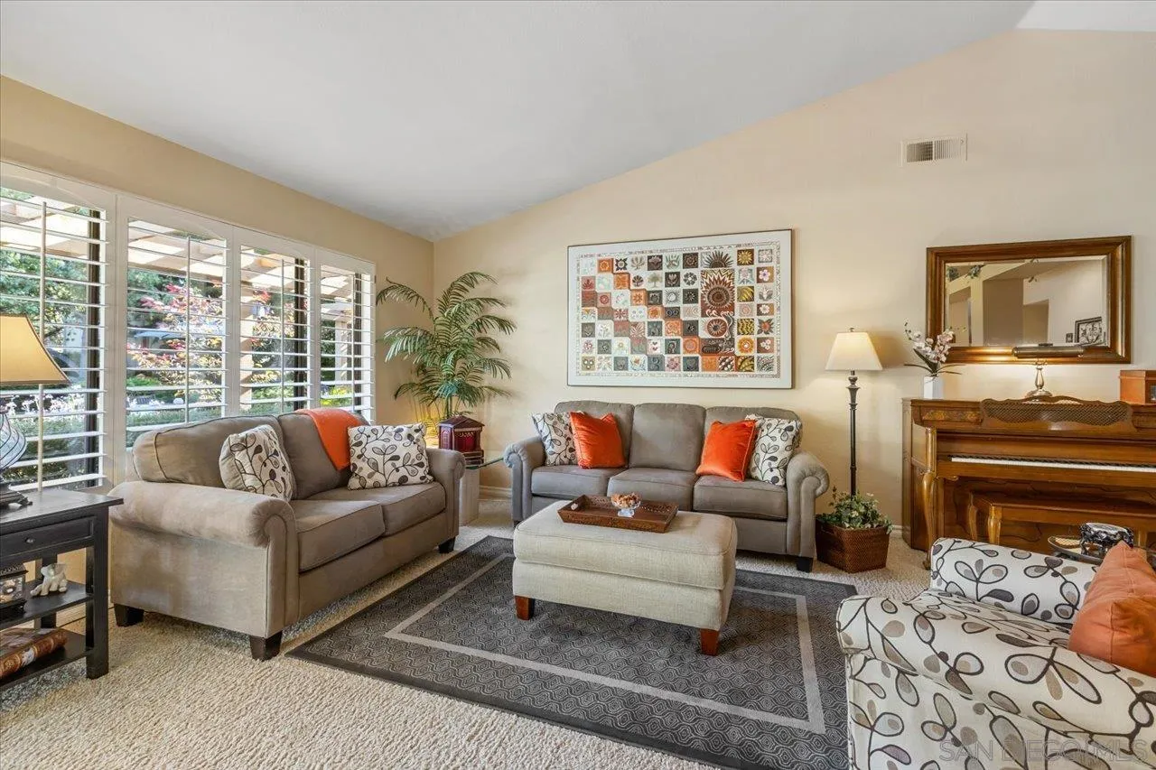 1787 Wolverine Way Vista, CA 92084 - Photo 17 of 35 a living room with furniture or couch and a fireplace