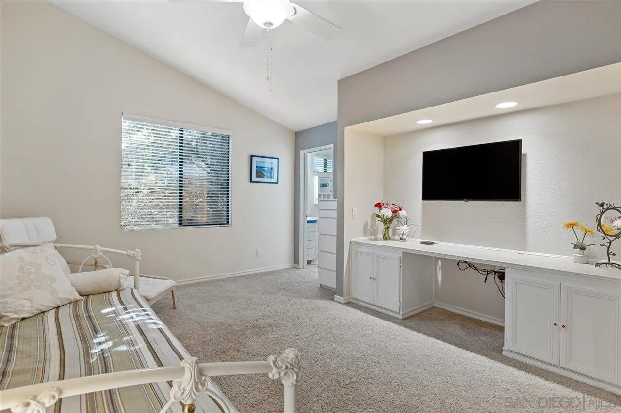 1787 Wolverine Way Vista, CA 92084 - Photo 20 of 35 a living room with furniture and a flat screen tv