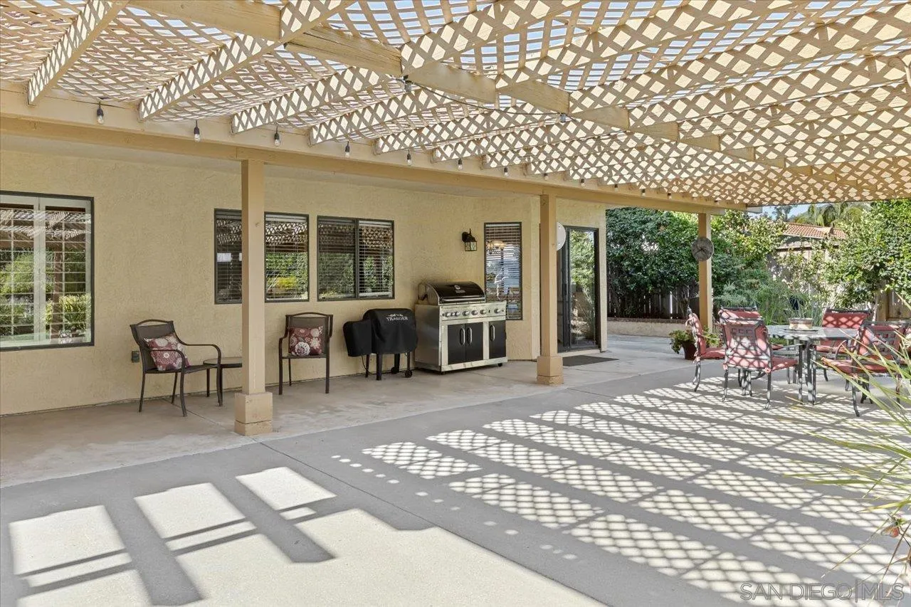 1787 Wolverine Way Vista, CA 92084 - Photo 26 of 35 a view of a patio with table and chairs