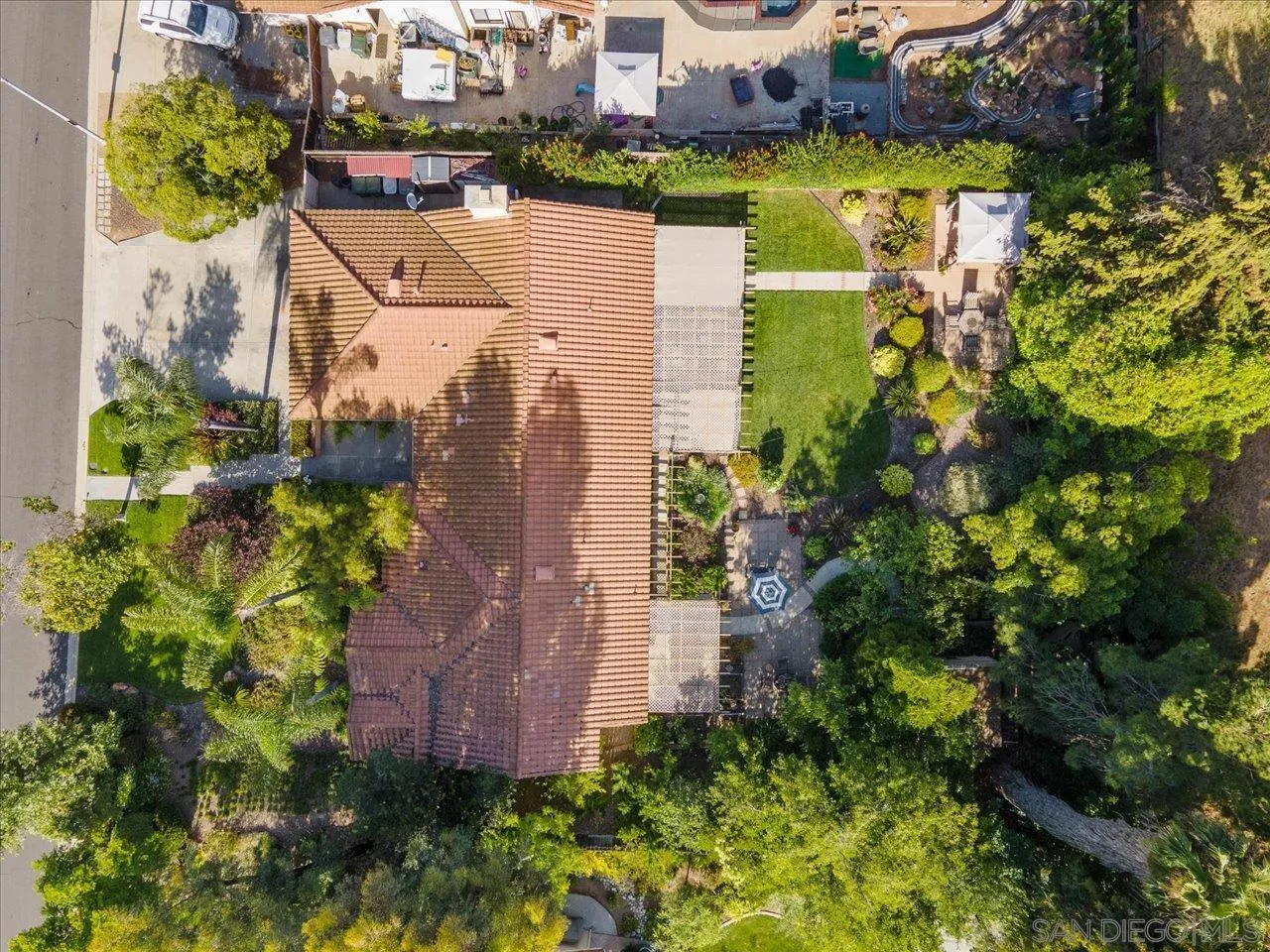 1787 Wolverine Way Vista, CA 92084 - Photo 5 of 35 an aerial view of a house with a garden and lake view