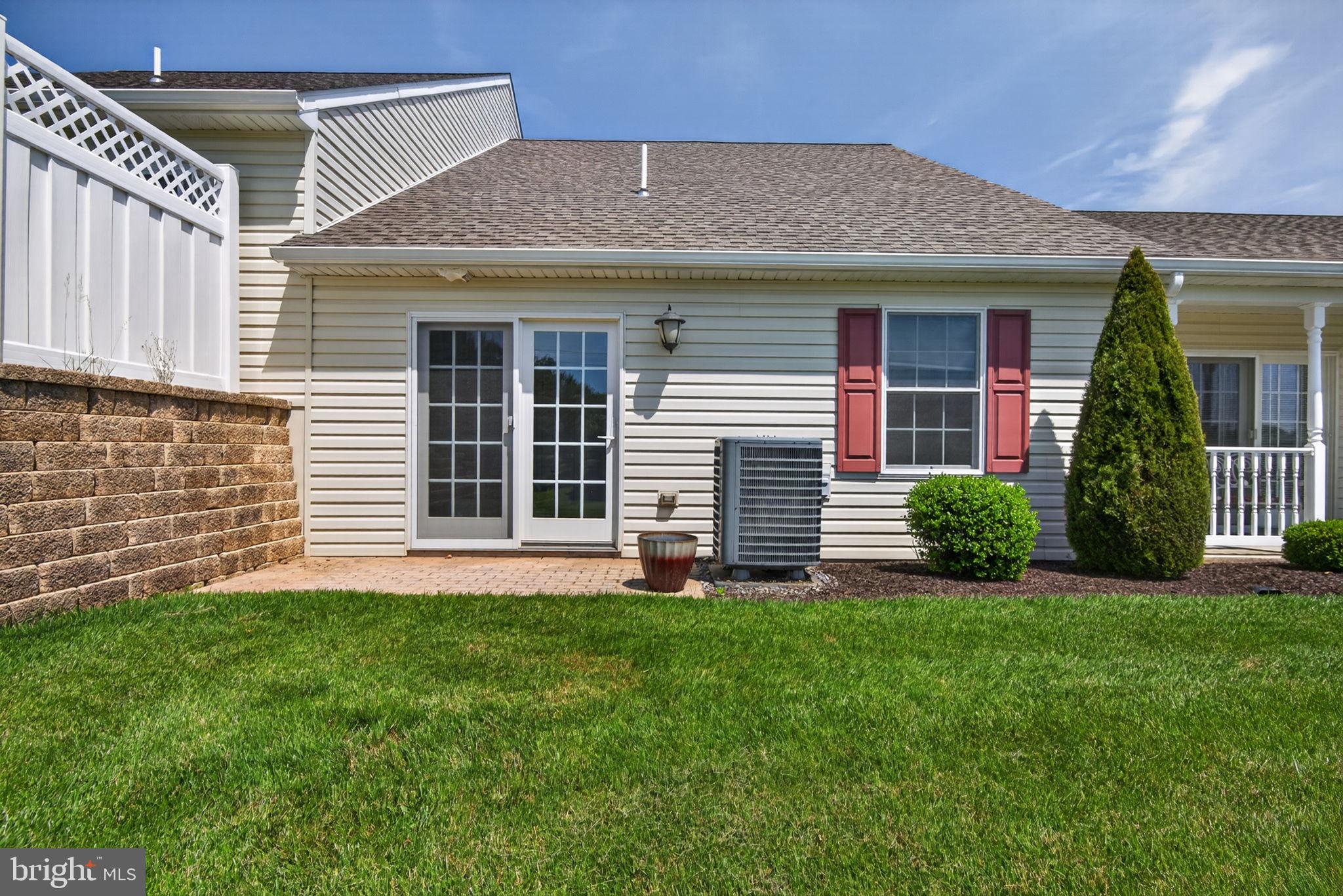 1332 Pleasant View Drive, Unit 75 Spring Grove, PA 17362 - Photo 26 of 26 a front view of a house with a garden