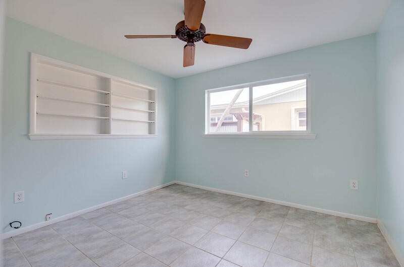 1006 16th Terrace Key West, FL 33040 - Photo 14 of 49 an empty room with windows and fan