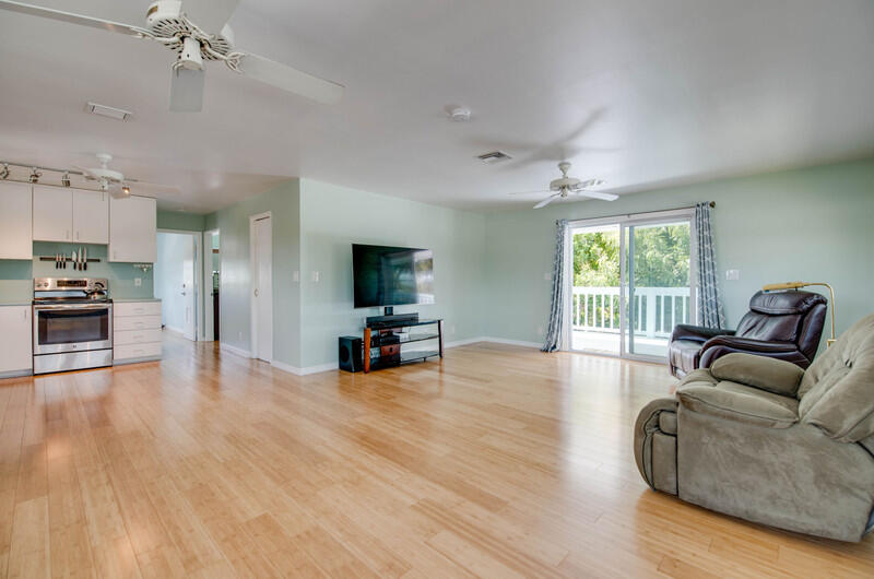 1006 16th Terrace Key West, FL 33040 - Photo 22 of 49 a living room with furniture and a flat screen tv
