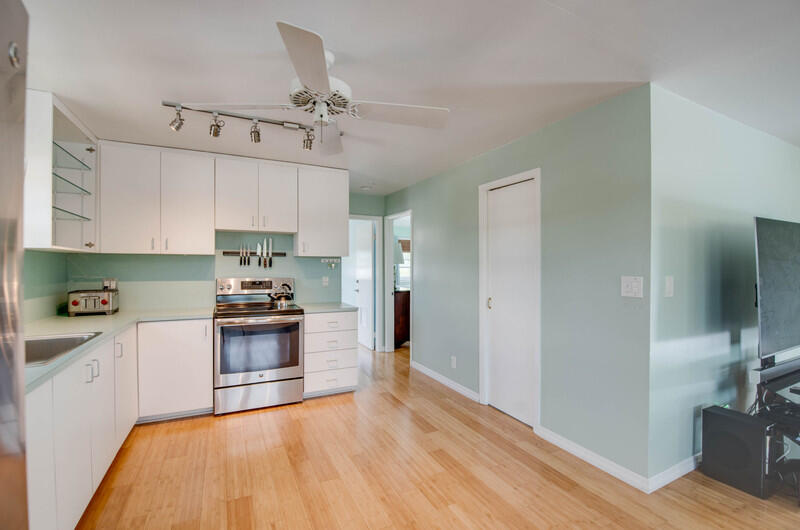 1006 16th Terrace Key West, FL 33040 - Photo 23 of 49 a kitchen with granite countertop a stove a sink and a refrigerator