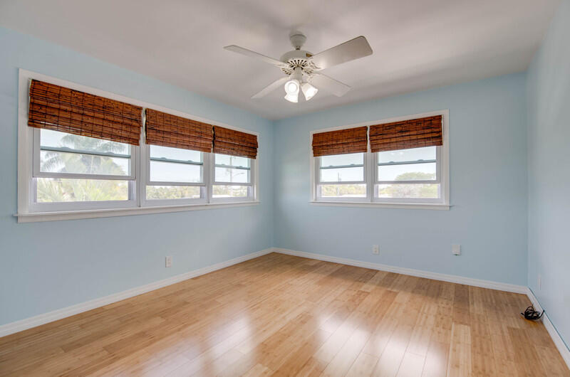 1006 16th Terrace Key West, FL 33040 - Photo 26 of 49 a view of an empty room with wooden floor and a window