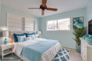 1006 16th Terrace Key West, FL 33040 - Photo 6 of 49 a bedroom with a bed and a potted plant