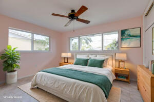 1006 16th Terrace Key West, FL 33040 - Photo 7 of 49 a bedroom with a bed and a potted plant