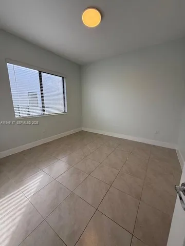a bathroom with a double vanity sink toilet and shower