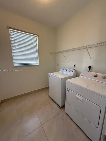 an empty room with a empty space and a window