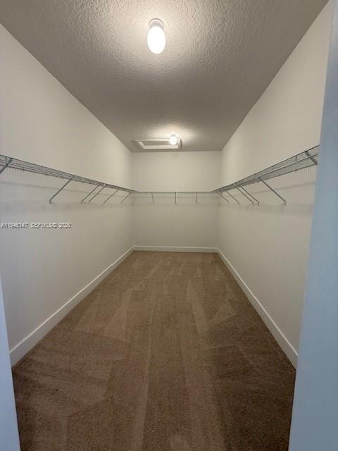4957 Gambero Way Ave Maria, FL 34142 - Photo 22 of 34 a view of a room with racks on the wall