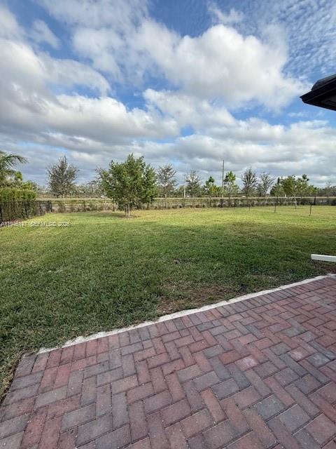 4957 Gambero Way Ave Maria, FL 34142 - Photo 7 of 34 a view of a lake with a big yard