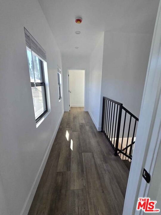 14121 Califa Street Sherman Oaks, CA 91401 - Photo 13 of 33 a view of a hallway view with wooden floor and staircase