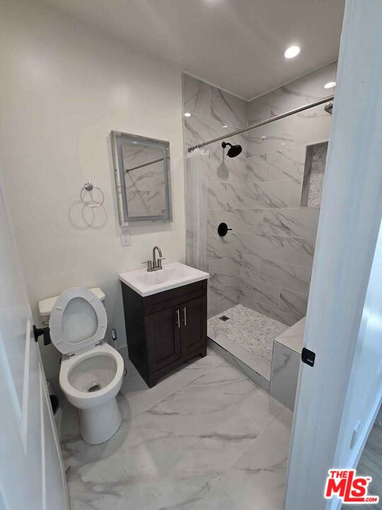14121 Califa Street Sherman Oaks, CA 91401 - Photo 20 of 33 a bathroom with a sink toilet a shower and bathtub