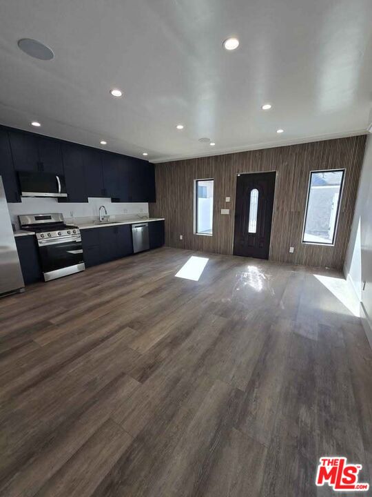 14121 Califa Street Sherman Oaks, CA 91401 - Photo 23 of 33 a view of a kitchen with a sink and a refrigerator