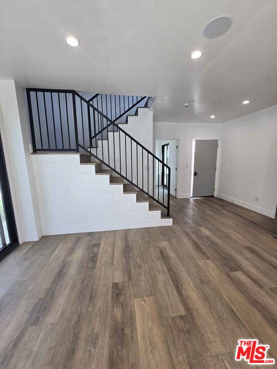 14121 Califa Street Sherman Oaks, CA 91401 - Photo 26 of 33 a view of a hallway with wooden floor