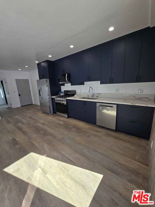 14121 Califa Street Sherman Oaks, CA 91401 - Photo 28 of 33 a large kitchen with stainless steel appliances a large counter top