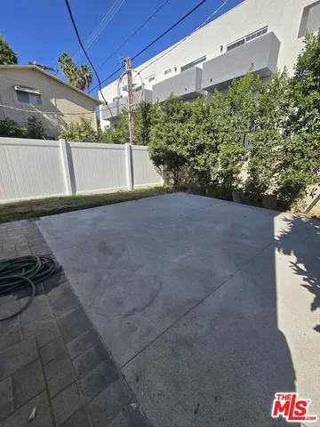 a view of a backyard of the house