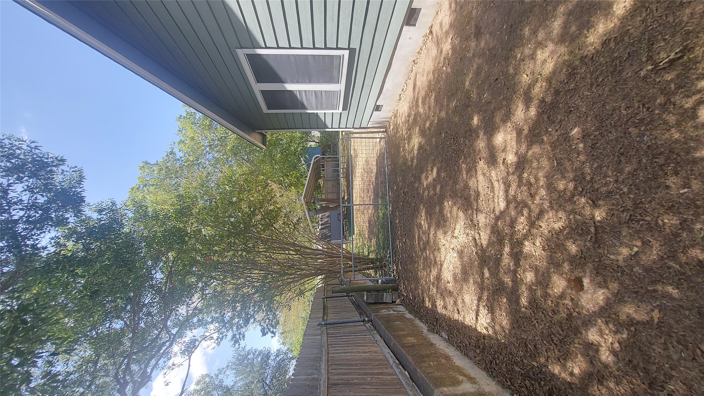 1411 Ruth Avenue Austin, TX 78757 - Photo 6 of 26 DRIVEWAY ALONG SIDE OF HOUSE TO CARPORT