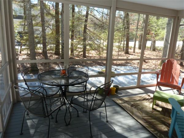 88 Hemlock Road Sudbury, MA 01776 - Photo 23 of 25 a view of a dining room with furniture and floor to ceiling windows