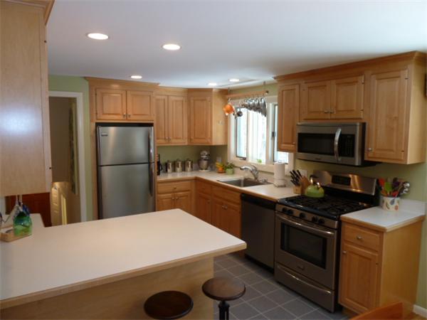 88 Hemlock Road Sudbury, MA 01776 - Photo 5 of 25 a kitchen with a sink a refrigerator and a stove top oven