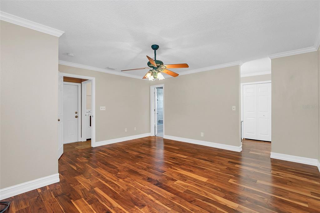 4147 Boggy Creek Road Kissimmee, FL 34744 - Photo 12 of 49 a room that has a bed and a chandelier