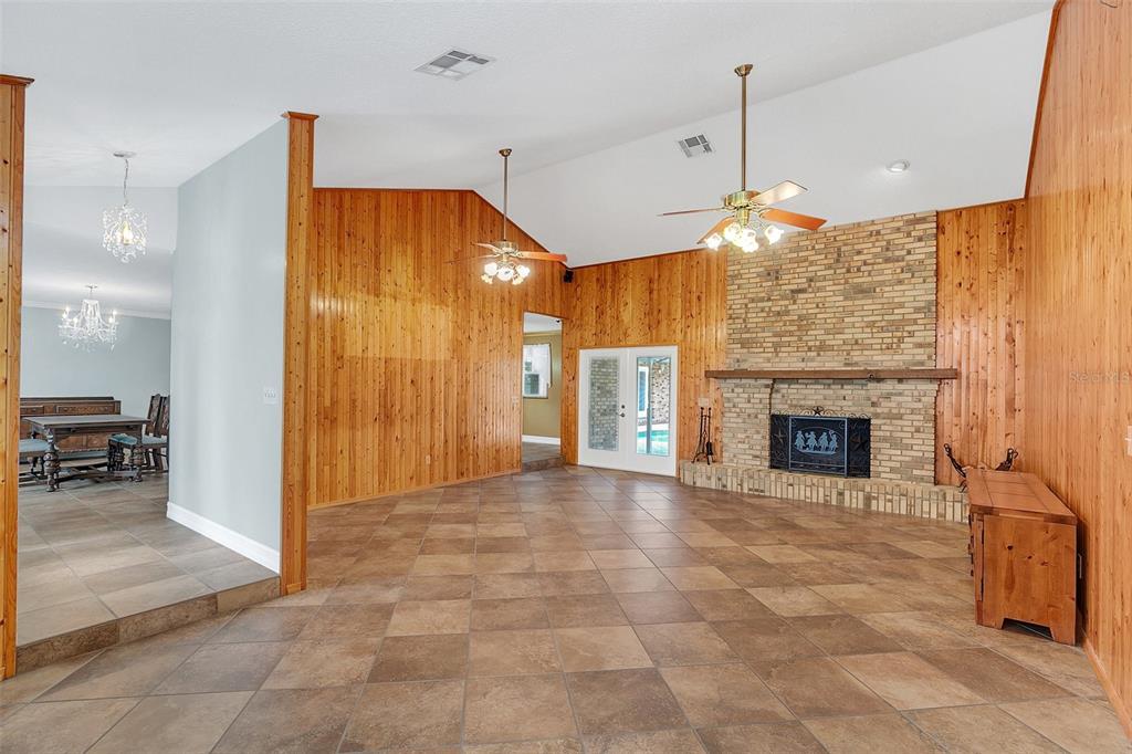 4147 Boggy Creek Road Kissimmee, FL 34744 - Photo 2 of 49 a view of an empty room with a fireplace and a window
