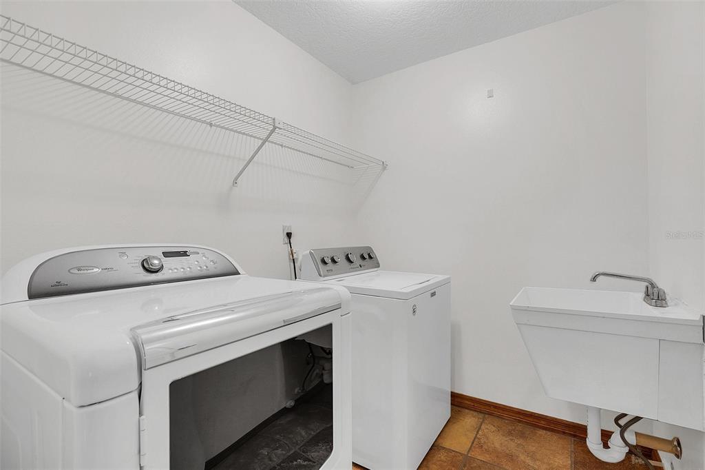 4147 Boggy Creek Road Kissimmee, FL 34744 - Photo 23 of 49 a utility room with dryer and washer